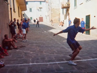 Palla, a traditional Tuscan ball sport, is an electrifying blend of agility and teamwork where players strike a heavy ball  with their hands to outmaneuver opponents in fast-paced, open-air matches